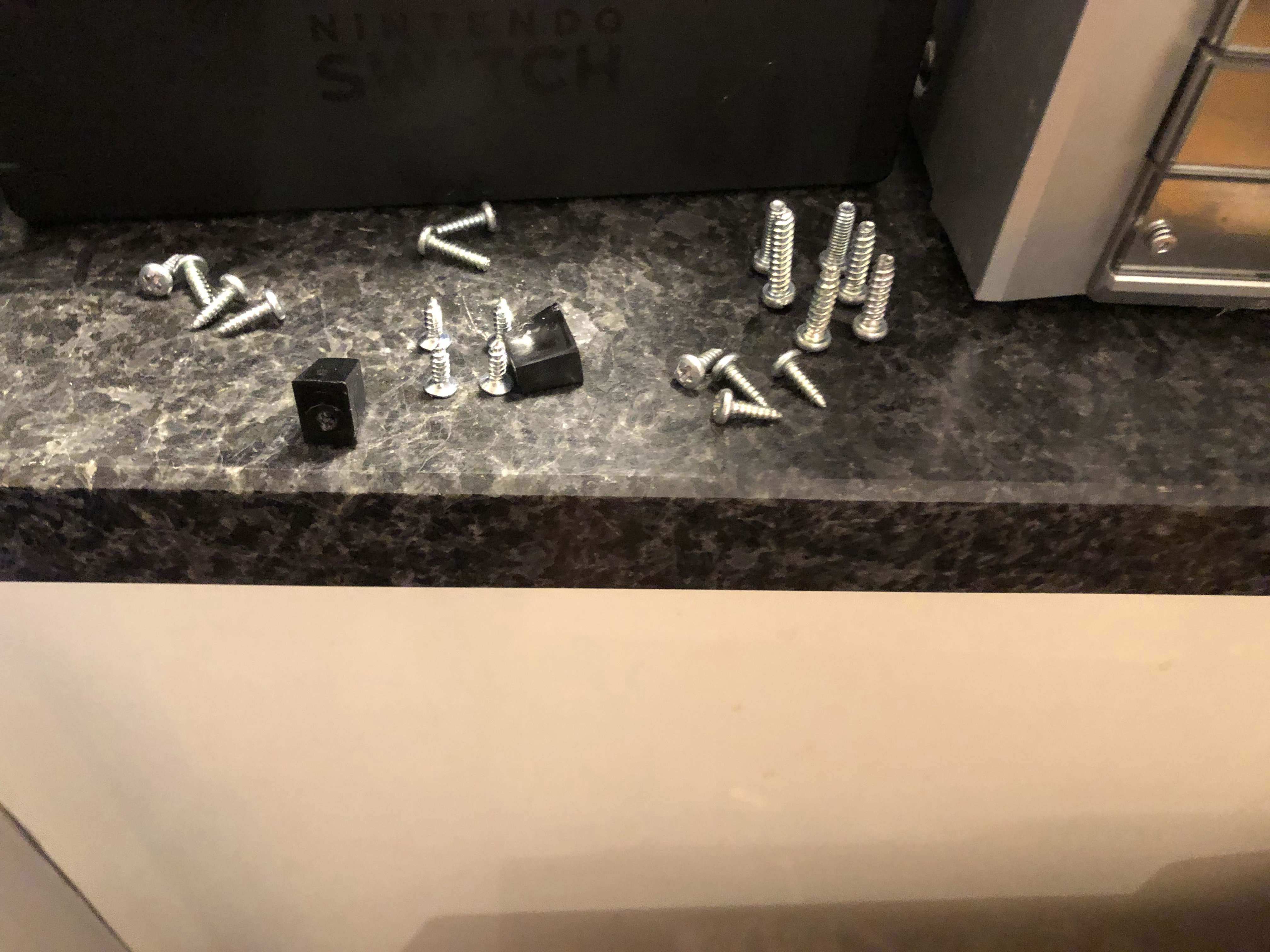 Twenty screws and two black bits of plastic.