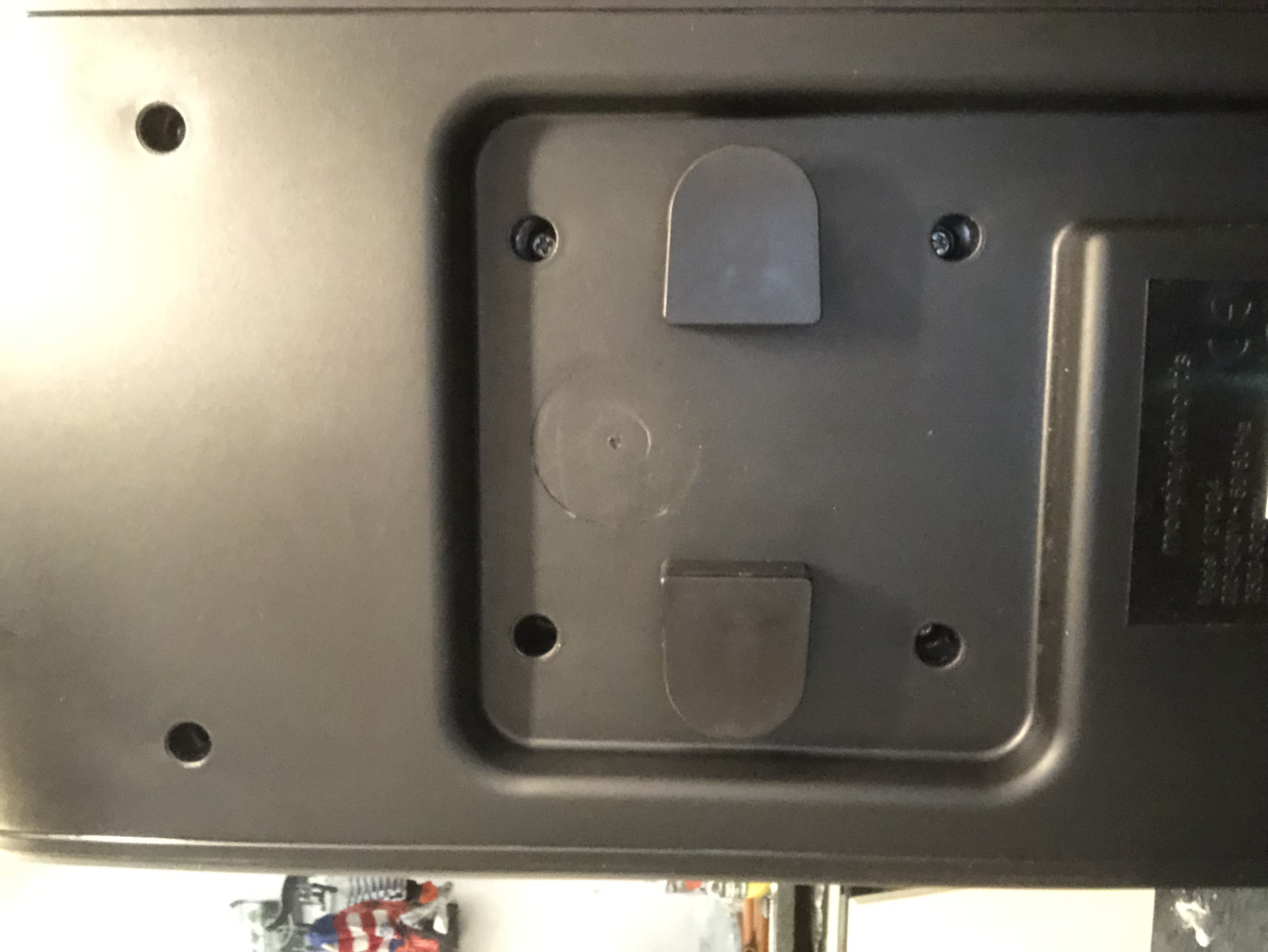 Back of the unit; 6 recessed screw holes